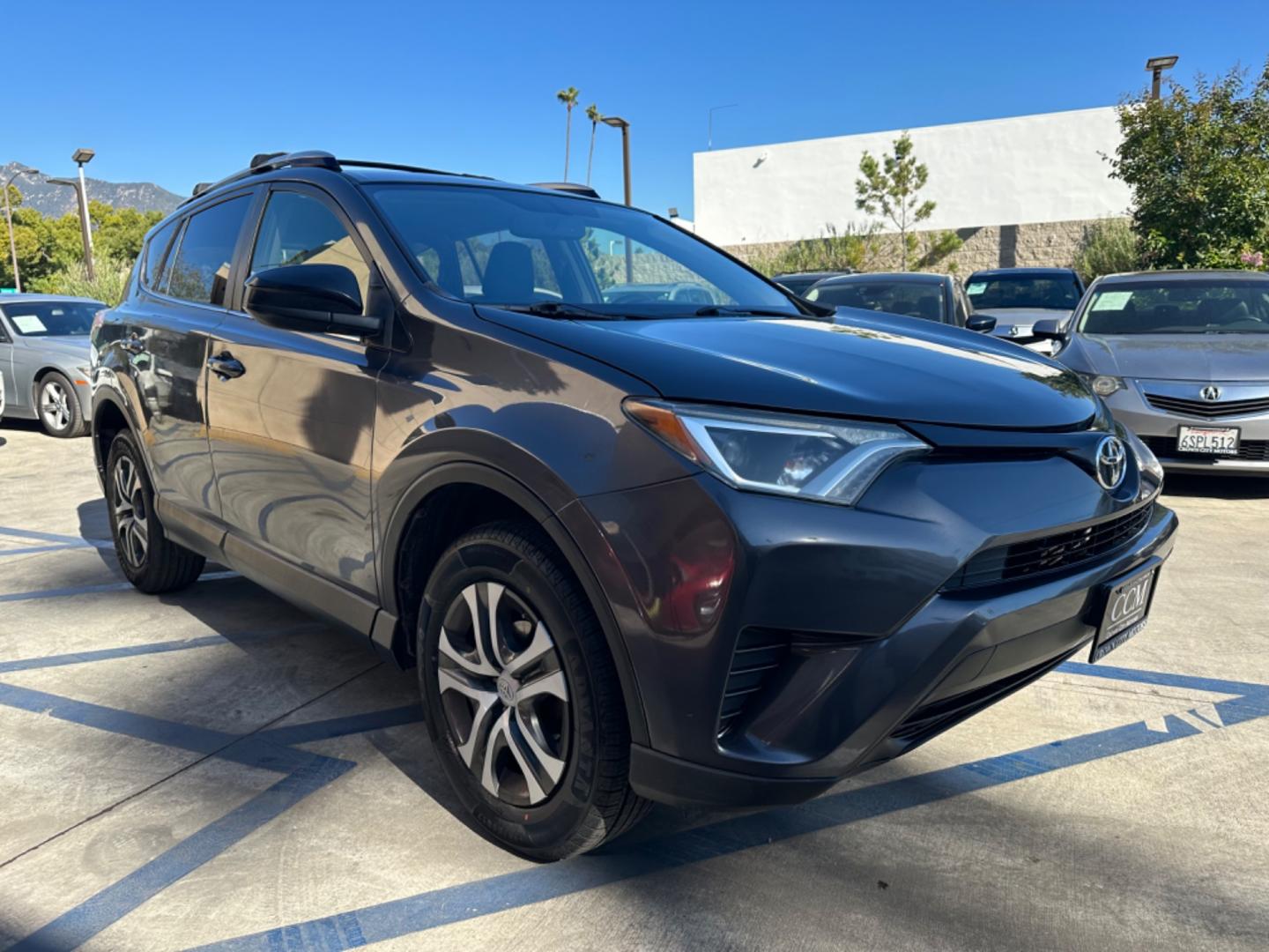 2016 Gray /Black Toyota RAV4 (JTMZFREVXGJ) , AUTOMATIC transmission, located at 30 S. Berkeley Avenue, Pasadena, CA, 91107, (626) 248-7567, 34.145447, -118.109398 - Crown City Motors is a used “Buy Here Pay Here” car dealer in Pasadena CA. “Buy Here Pay Here” financing, means that when you purchase your vehicle from our dealership, that you make the payments to the dealership as well. We do not need the banks approval to get you approved for a used auto - Photo#5